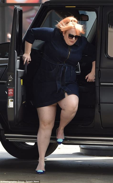 rebel wilson stuns in dress but struggles to get out of her huge suv daily mail online