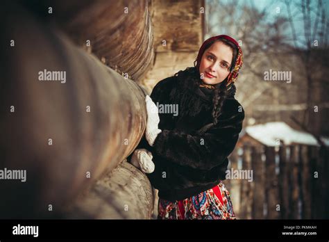 russian woman beautiful in the dress and the fur coat in the winter