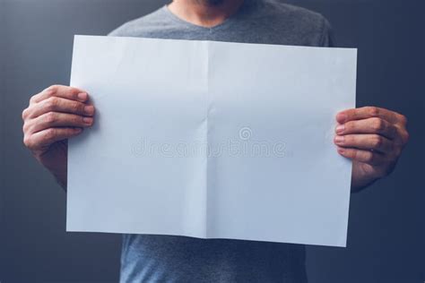 casual man holding blank  paper spread  copy space stock image image  magazine male
