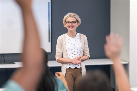 mature adult female teacher presents lecture in medical