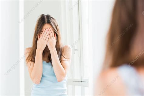 woman hiding  face   hands stock image  science photo library