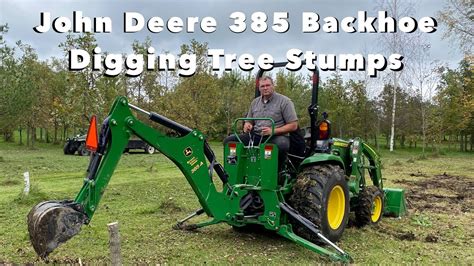 digging  tree stumps wjd  backhoe   compact tractor     youtube
