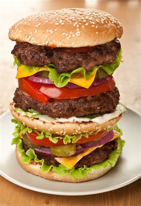 large triple cheeseburger stock image image  grilled