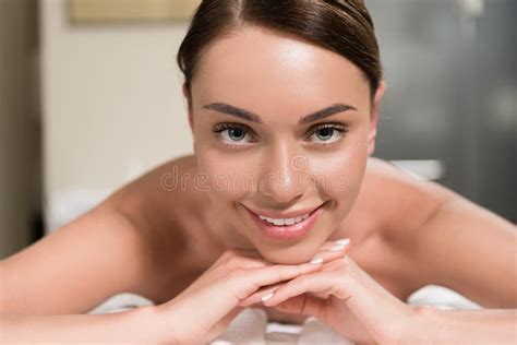 Young Woman Lying On Massage Table And Smiling Stock Image Image Of