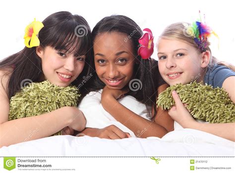 Teenage Girls Flowers In Hair At Sleepover Party Stock