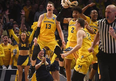 ncaa tournament  michigan student manager brings cheers