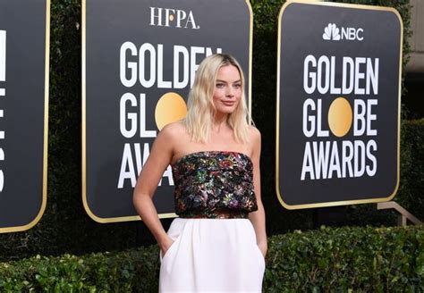 margot robbie flashes the flesh in daring gown for golden globes 2020