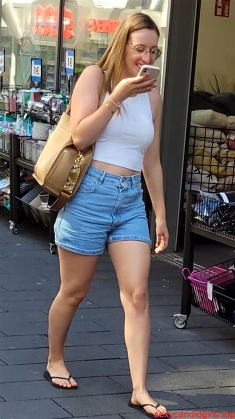 Stocky Candid Girl Wearing A Top Denim Shorts And Slippers Street