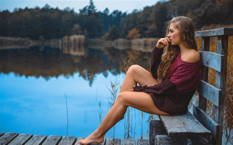 girl beautiful long legs girl outdoors alone water bench