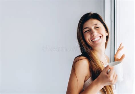 Smiling Girl By The Window Brunette Girl Is Drinking Her Morning