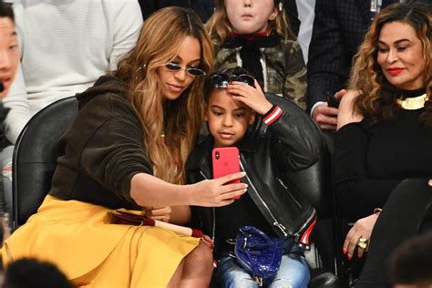 blue ivy carter and beyoncé sit courtside at the nba all star game
