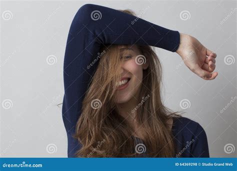happy gorgeous young woman hiding  face  hair stock photo image  satisfaction joyful