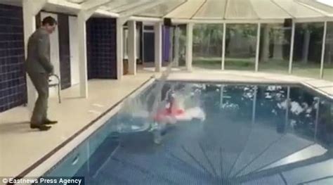 Video Shows Estate Agent Being Pushed In A Swimming Pool By Colleague