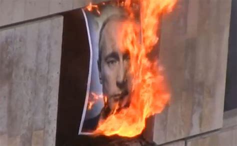 Pussy Riot Burn Portrait Of Russia S President Vladimir Putin Telegraph