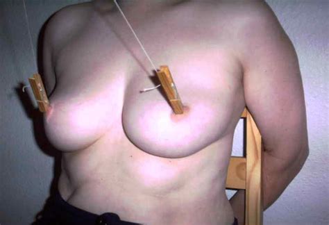 needles and clothespins on nipples torture bdsm photos
