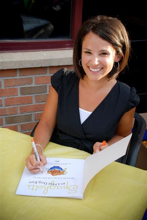 Author Maria Dismondy Signing A Copy Of Her Book Author