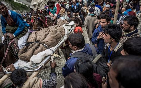 thousands of hindus make a pilgrimage to amarnath cave in the himalayas