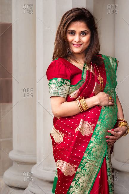 portrait of a beautiful pregnant woman wearing a saree
