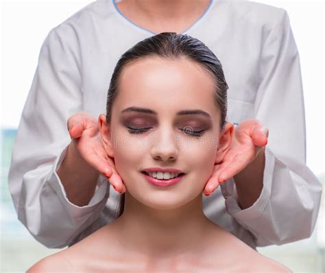 The Young Woman During Face And Skin Massage Session Stock Image