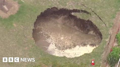 sinkhole swallows australian backyard bbc news