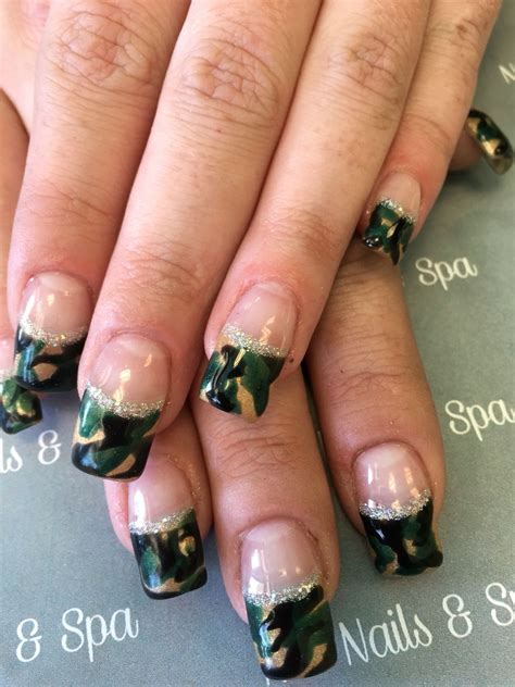 womans nails  green  white designs   including gold