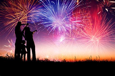 group of people enjoying spectacular fireworks show in a carnival or holiday stock image image