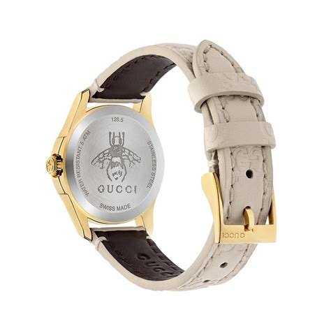 gucci g timeless signature 27mm yellow gold white dial