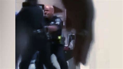 detroit police officer suspended after video shows him punching naked woman at hospital abc news