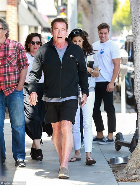 Arnold Schwarzenegger Embraces Joseph Baena As They Grab