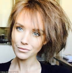 Nicky Whelan Shows Off Her Tiny Waist As She Strips Down