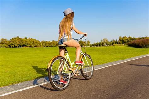 hd wallpaper girl grass bicycle road shorts sky long hair legs