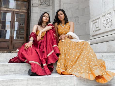 a same sex couple took pictures in traditional south asian