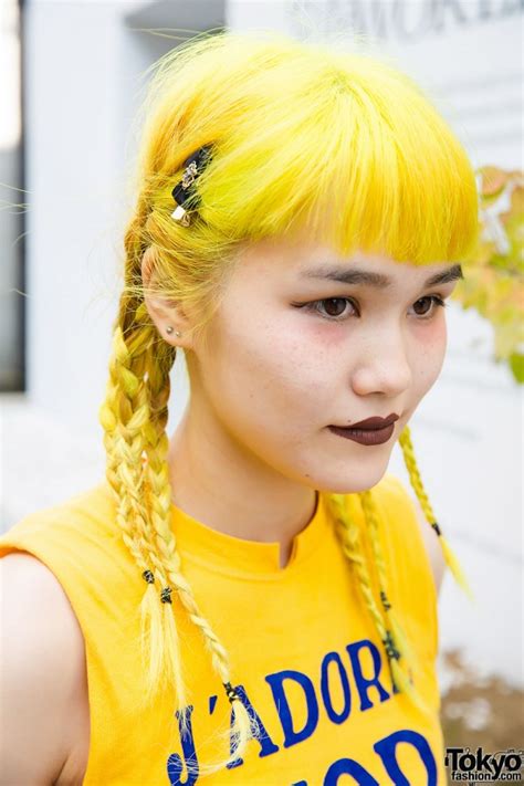 yellow hair in braids j adore dior top and pleated skirt in harajuku