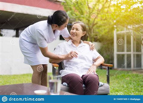 Nurse Taking Care Of Her Patient Mature Asian Elderly Woman Happy And