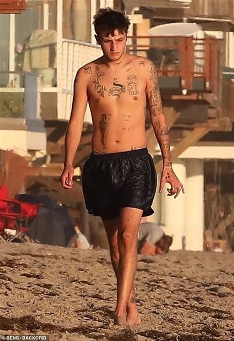 Anwar Hadid Shows Off His Tattoos As He Enjoys A Solo Beach Day And