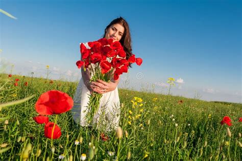 Summer Girl In Poppy Field Holding A Poppies Bouquet Stock Image