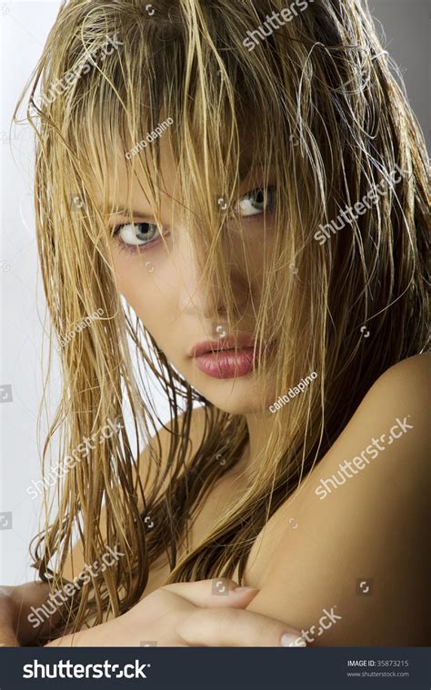 Sensual And Beautiful Blond Girl With Long Wet Hair On Her