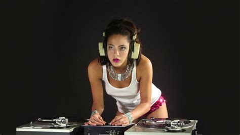 a sexy female dj dancing and playing records this is a