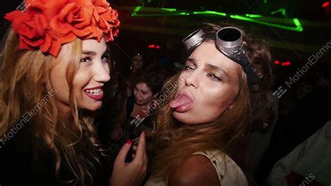 sexy lesbian at halloween party in nightclub flower rim aviator