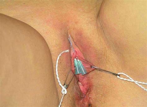 insertion of needles in clitoris torture bdsm photos