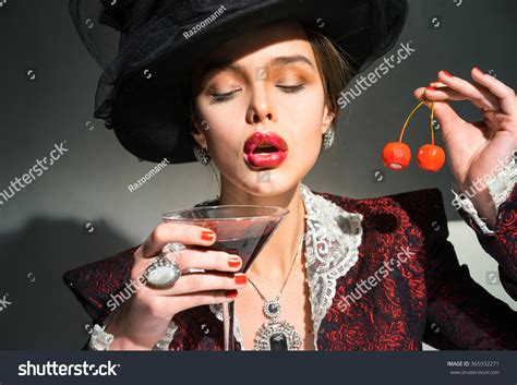 Vintage Woman Drinking Martini Glass Cherry Foto Stock 365932271