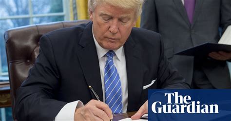 trump takes busy pen to obama legacy us news the guardian