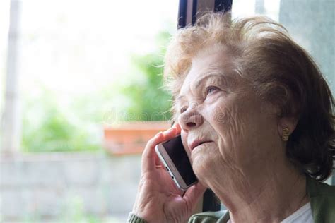 senior woman talking on the cell phone or smartphone stock image