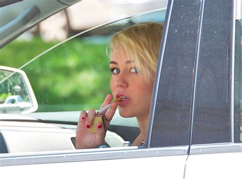 miley cyrus puffs cigarette shows off smoking new haircut in