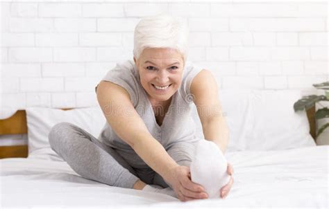 Charming Cheerful Mature Woman Stretching Her Legs Stock Image Image