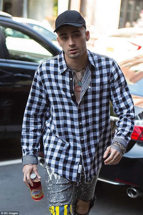 zayn malik shows off his unique sense of style and tattoo collection