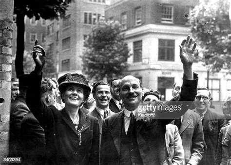 british prime minister clement attlee and his wife violet waving to