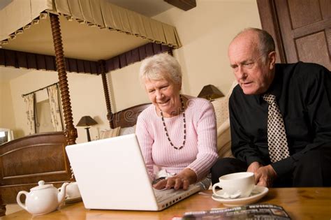 Mature Older Couple Using Laptop Stock Image Image Of Cheerful