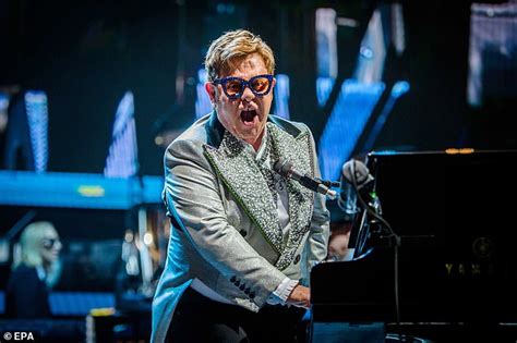 elton john 72 looks typically dazzling in a powder blue crystal embellished suit daily mail