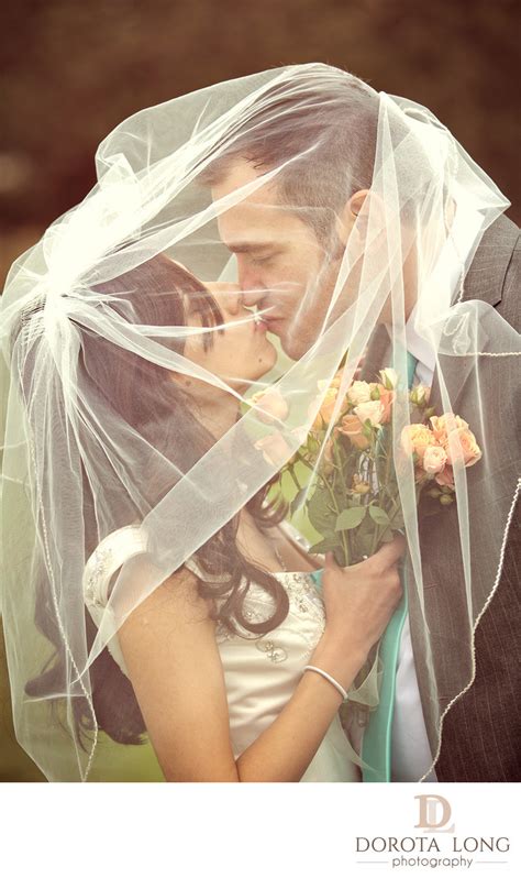 Wedding Couple Kissing Under Veil In New Milford Ct